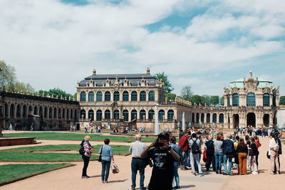 Group of people in front of historical building