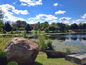 Scenic view of lake against cloudy sky