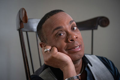 Portrait of smiling man on chair