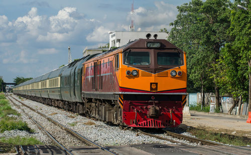 Train on railroad track against sky