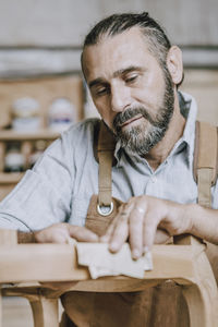 Carpenter working in workshop