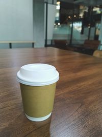 Close-up of coffee cup on table