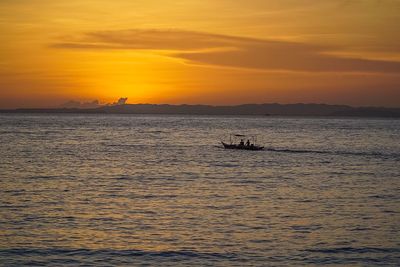 Scenic view of sea at sunset