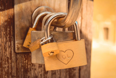 Close-up of padlocks hanging on metal