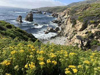 Scenic view of sea against mountain