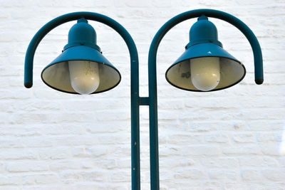 View of lamp post against blue sky