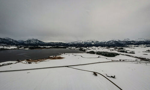 Scenic view of frozen lake against sky