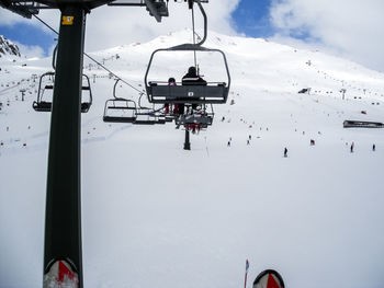 Overhead cable car against sky during winter