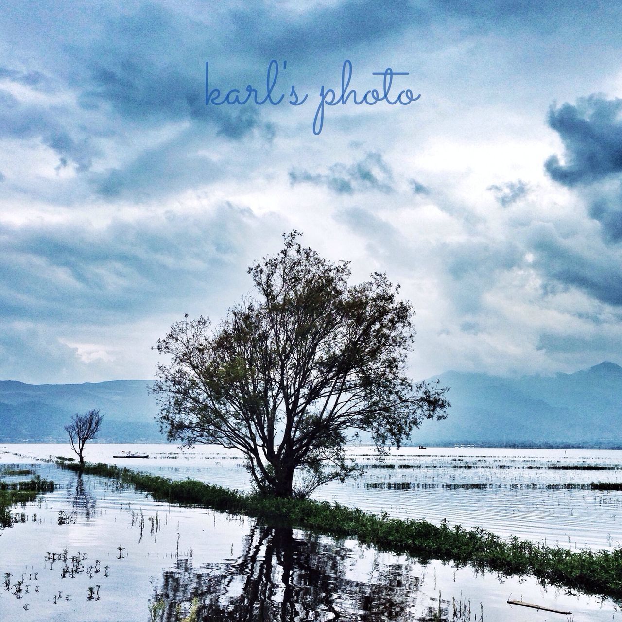 sky, tranquil scene, tranquility, scenics, tree, landscape, nature, cloud - sky, beauty in nature, water, bare tree, winter, cloud, cold temperature, non-urban scene, day, field, snow, mountain, cloudy