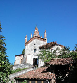 Low angle view of building against clear blue sky