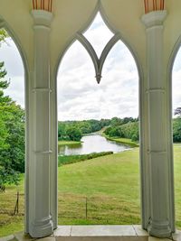 Scenic view of field seen through window