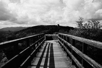 Footbridge against sky