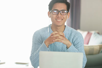 Portrait of young man using smart phone