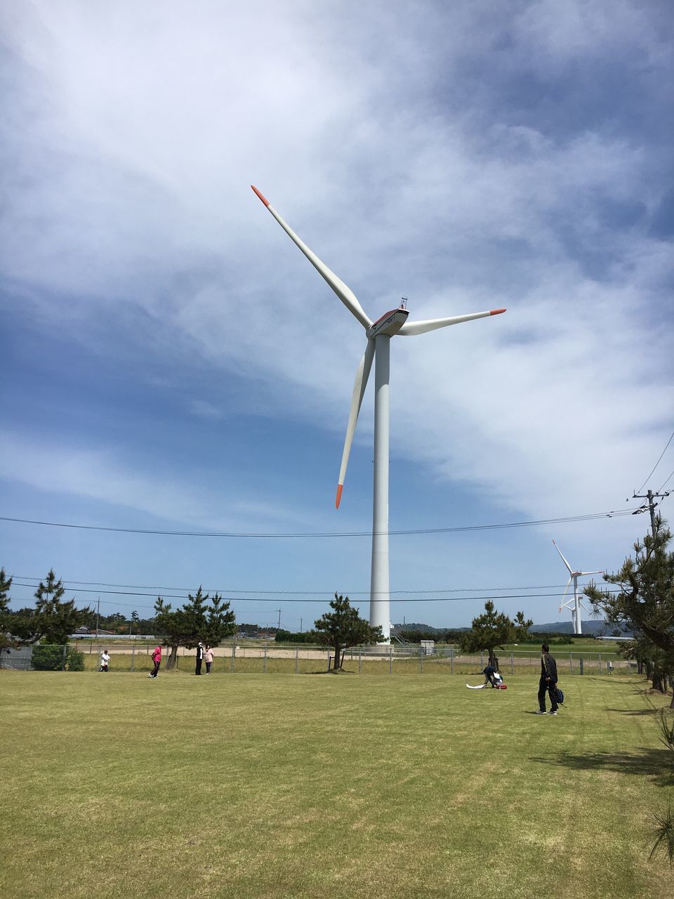 wind turbine, wind power, alternative energy, renewable energy, windmill, environmental conservation, fuel and power generation, sky, field, nature, grass, outdoors, day, cloud - sky, real people, industrial windmill, men, landscape, togetherness, beauty in nature, tree, traditional windmill, people