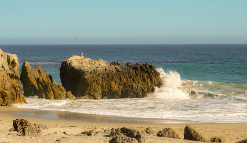 Scenic view of sea against clear sky