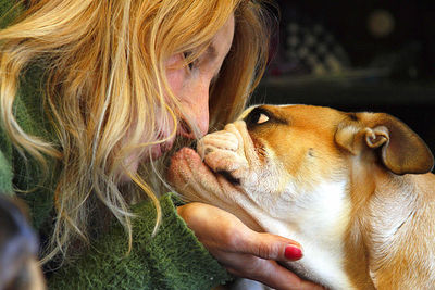 Close-up of woman with dog