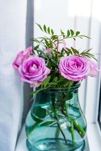 Close-up of rose bouquet in glass vase