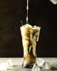 Close-up of ice cream in glass on table