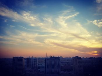 Cityscape against sky during sunset