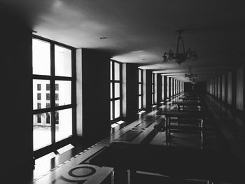 Empty chairs and tables in building