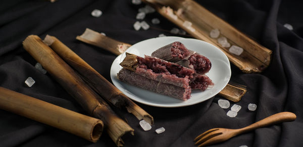 Close-up of food on table against black background