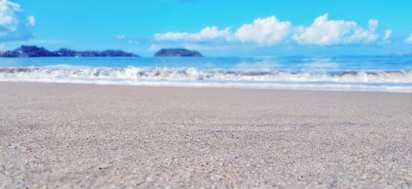 Surface level of beach against sky