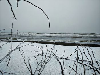 Scenic view of sea against sky during winter