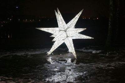 Reflection of illuminated water at night