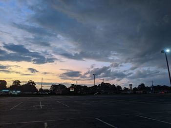 Road against cloudy sky at sunset