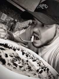 Portrait of young man holding food