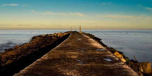 Scenic view of sea against sky at sunset
