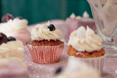 Close-up of cupcakes on cake