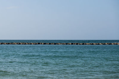 Scenic view of sea against clear sky