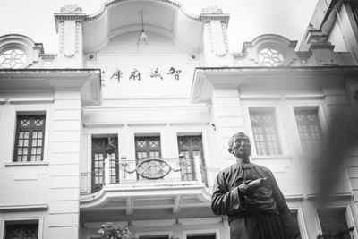 Low angle view of statue against building