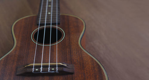 High angle view of guitar on table