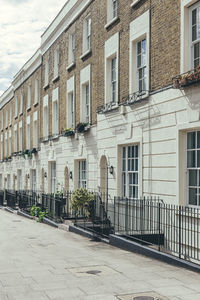 Street by building against sky