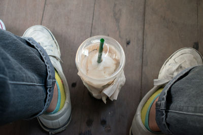 Milkshake between shoes