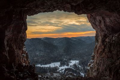 Scenic view of mountains against sky during sunset  grotto