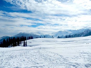 Scenic view of snow covered landscape against sky