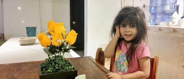 Portrait of cute girl with flowers