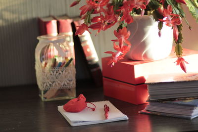 Close-up of red rose on table