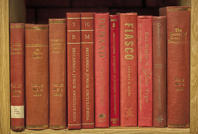 Close-up of red books on shelf