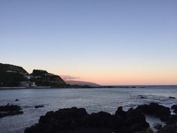 Scenic view of sea at sunset