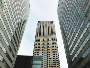 Low angle view of modern buildings against sky