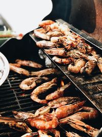 High angle view of meat on barbecue grill