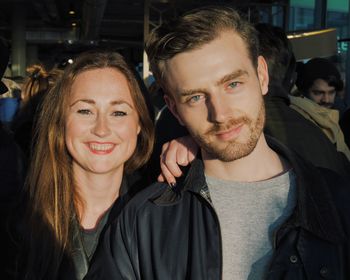 Portrait of smiling young man and woman