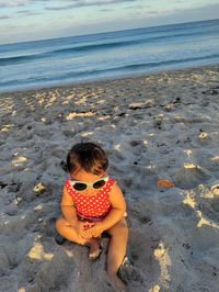Girl sitting on beach