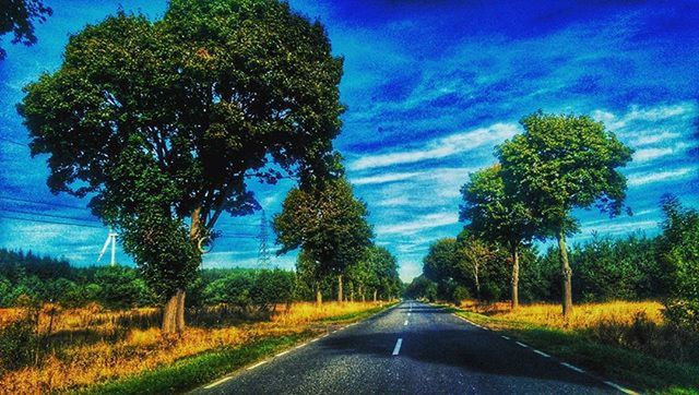 the way forward, road, transportation, diminishing perspective, tree, vanishing point, sky, country road, road marking, tranquility, blue, empty road, tranquil scene, nature, empty, long, cloud - sky, landscape, cloud, scenics