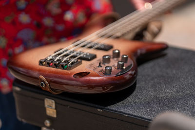 Close-up of guitar playing piano