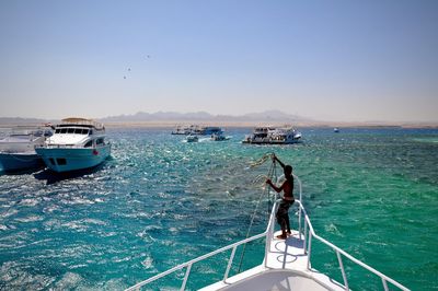 Front of boat sailing in sea against clear sky in egypt